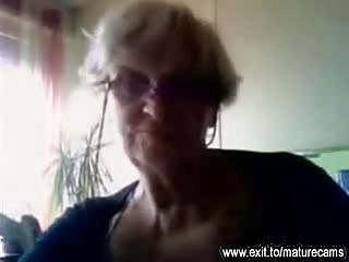 Granny with huge tits playing at home