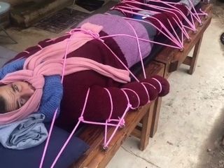 'Wool mohair layers of sweaters on a restrain bondage table '