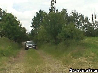 Old whore takes two dicks outdoor