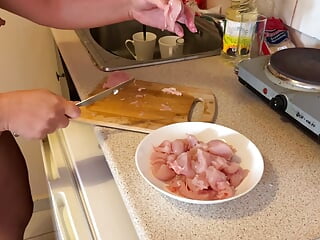 Zara is cooking stripped to the waist in the kitchen