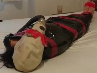'BDSM gimp gal, plastic mummification with gasmask Breathplay'